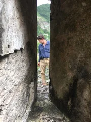 Stefan Burns looking at the rocky ground at the Edinburgh Castle.