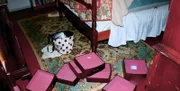 Empty jewelry drawers sit stacked on the floor of Kathy Blair's bedroom