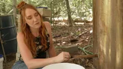 AMANDA BRYANT WAITS FOR THE LIQUOR TO START POURING OUT OF THE STILL
