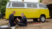 Ant Anstead and Darren sitting on the floor infront of the camper