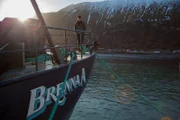 Captain Sean Dwyer on the deck of the Brenna A, docked in Dutch Harbor.