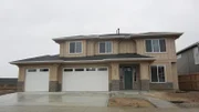 This home in Meridian, ID is a brand new build that is contemporary, with a touch of rustic with it's half-stone half-timber exterior, fitting perfectly in the suburbs of Idaho, as seen on House Hunters.