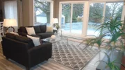 As seen on House Hunters, Jordan loves the amount of light this living room has in the suburbs of Buffalo, New York.