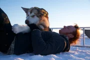 Sam Tenhoff and Kiska hang out on the ice.
