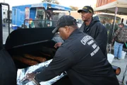 Michael Character and Thomas Pulliul working on meat.