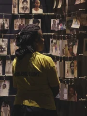 A visitor looks at the photo exhibit at the Kigali Genocide Memorial, which documents the 1994 Genocide against the Tutsi population in Rwanda.