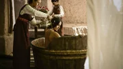 Scene 4/72 - Ext Davids Palace, Garden Courtyard; Bathsheba (MELIA KREILING) washes as 2 maid serevants hold up a sheet.