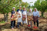 Presenter Rob Rinder with cherry pickers near Borgo Egnazia, Italy