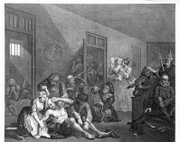 An insane man (Tom Rakewell) sits on the floor manically grasping at his head, his lover (Sarah Young) cries at the spectacle whilst two attendants attach chains to his legs; they are surrounded by other lunatics at Bethlem hospital, London.