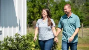 Homeowners Jeremy and Taylor approaching their new dream home for the first time on reveal day.