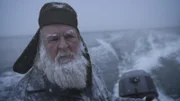 Gary Muelberger cautiously making his way to shore to set up a couple of martin traps.