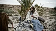 Scene 06/44 - Exterior Bethelem Road; Joseph (JOE COEN) and Mary (LEILA MIMMACK) on their nlong travels.