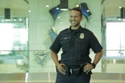 CBP Officer Tai waits for an international flight to deplane at Miami International Airport. (National Geographic/Lucky 8 TV)