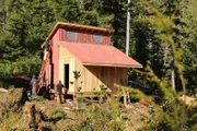 Community members help Hans & Timbi build a duck pen at their home in Port Protection, AK.