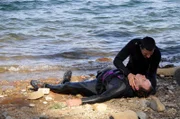 Episode 101 Burning Car and Lake Rescue. Bear Grylls performs CPR to the jet ski driver.