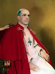 Portrait of Pope Pius XII seated on throne.