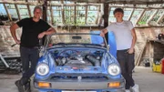 Ant & Archie standing on either side of the MG at the farm