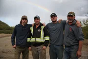 Schnabel crew photo in front of a rainbow.