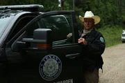 Warden Mike Boone exiting the truck.