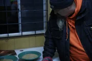 Todd Hoffman looking at the gold pans.