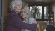 Dora Williamson (Louise Thompson) and Margaret Conway (Katherine McKalip) look on as sister's dead body is taken away.