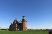 Clients Mike Jackson and Robin Vieira outside the light house, on Block Island, Rhode Island, as seen on HGTV's "Island Life"