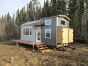 Ana and Jacob White's completed tiny house on their property at Quartz Lake in Delta Junction, Alaska as seen on Tiny House, Big Living.