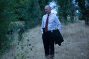 David Foster investigates the crime scene.