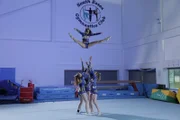 ESSEX, ENGLAND - The Essex Stars Cheerleading Team perform a basket toss.