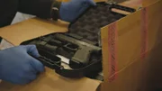 Gun in a holster was found while checking the boxes.
