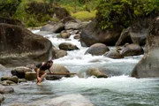 Hazen Audel jumping into a river.