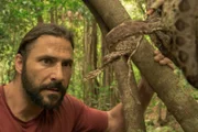 Surama, Guyana - Hazen encounters an aggressive tree boa while climbing to collect vines.