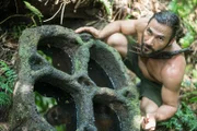 Vanuatu - Hazen finding archaeological stones in the pristine jungle.