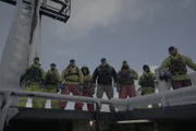 Captain Keith Colburn and his entire Opie season crew pose for a group shot near the icy mast of the Wizard.