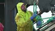 Brenna A deckhand Kyle Craig assists with hauling gear.