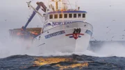 Northwestern cuts through small waves.