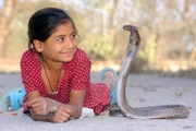 Snake Girl Kajol Khan from India plays with deadly cobras