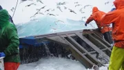 The icy, crisp blue waters of the Bering Sea pound into the Northwestern.