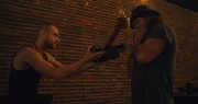 Mike (l.) gifting Jason a guitar