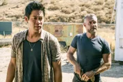 L-R: Victor Tan (David Lim) and David 'Deacon' Kay (Jay Harrington)