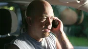 Chris on the phone in the car.