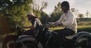 L-R: Jason and Mike Wolfe riding Harleys