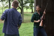 Recreation of Daniel Blair watching as his roommate, Aron Moss, loads a rifle.