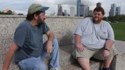 Justin and his friend are on a bench.