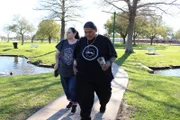 Roni and Michael walk.