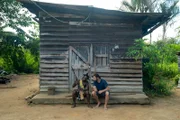 Hazen Audel and Fred looking at a shot gun.