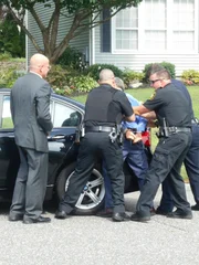 Police arrest Richard in his car. Police arrest Richard in his car.