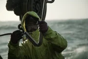 Deckhand Hank Todd with the crane hook on the Brenna A.