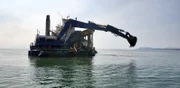 A shot of the Myrtle Irene in action as it digs for buried gold.