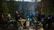Ness crew all gathered around fire pit for gold weigh